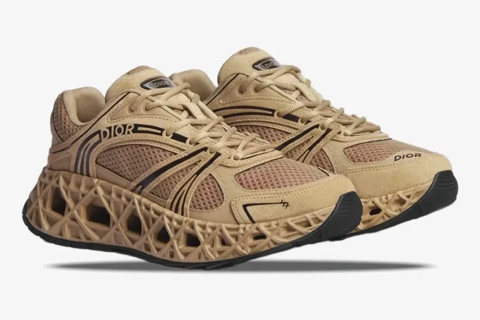 Dior B35 NXXT sneakers in beige suede and red mesh, shown from a three-quarter side view. - SKU 3SN323AAY_H134