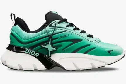 Side view of the Dior B44 Blade x Kaws sneaker featuring green mesh, black accents, and a white midsole. - SKU 3SN310ZWL_H660