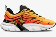 Side view of Christian Dior B44 Blade x Lewis Hamilton sneakers in gradient orange with black and white details. - SKU 3SN310ZWL_H261