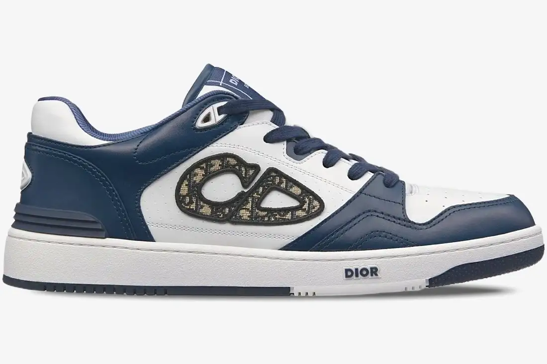 dior-b57-dribble-low-blue-white-side-view-3sn318zxu-h553-688-520 Side view of Dior B57 Dribble low-top sneaker in blue and white leather with CD logo. - SKU 3SN318ZXU_H553
