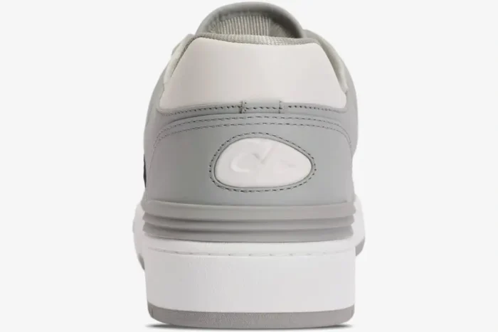 Rear view of Dior B57 Dribble Low-Top Sneaker in white and grey leather with CD logo on the heel. - SKU 3SN318ZXU_H860