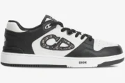 Dior B57 low-top sneaker in black and white leather with Oblique jacquard CD logo, side profile view. - SKU 3SN318ZXU_H960