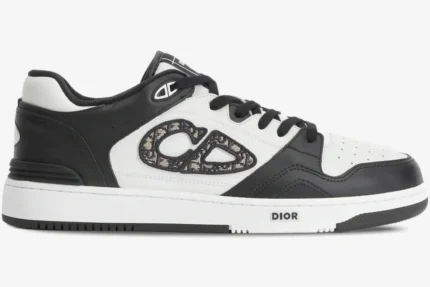 Dior B57 low-top sneaker in black and white leather with Oblique jacquard CD logo, side profile view. - SKU 3SN318ZXU_H960