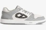 Side profile of a Dior B57 low-top sneaker in white and grey leather with an Oblique CD logo. - SKU 3SN318ZXU_H860