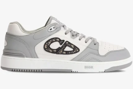 Side profile of a Dior B57 low-top sneaker in white and grey leather with an Oblique CD logo. - SKU 3SN318ZXU_H860