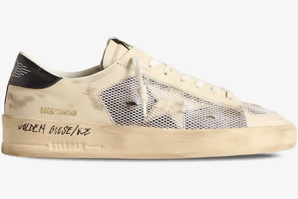 golden-goose-stardan-white-mesh-side-view-gmf00580-f004567-10768-517-921 Side profile of Golden Goose Stardan white leather and mesh distressed sneakers with a yellowed midsole. - SKU GMF00580.F004567.10768