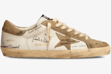 Golden Goose Super-Star LTD Miami Graphics sneaker in white and beige, side profile view with handwritten details. - SKU F002647