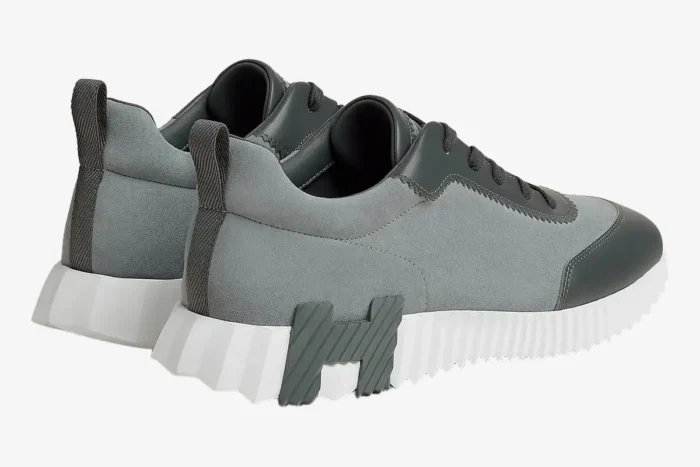 Hermès Bouncing Sneaker in grey and white, rear three-quarter view showing the chunky sole and H logo. - SKU H231763ZH6I400