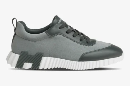 Side profile of Hermès Bouncing Sneaker in grey suede and leather with a white chunky sole. - SKU H231763ZH6I400