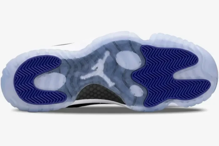 Bottom view of Jordan Air Jordan 11 Retro Concord showing icy blue translucent outsole and purple traction pads. - SKU 378037-100