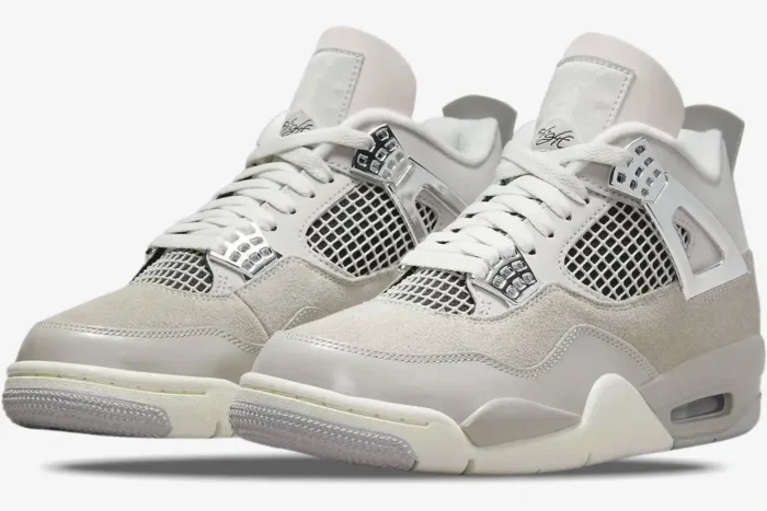 Air Jordan 4 Retro Frozen Moments in light grey and silver, three-quarter front view of both sneakers. - SKU AQ9129-001