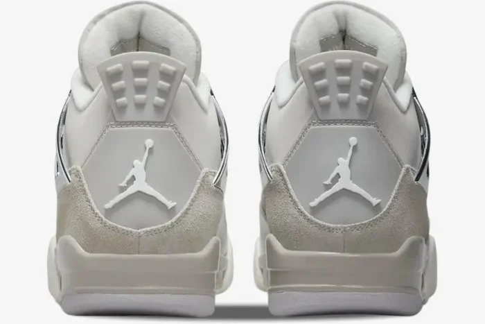 Rear view of Air Jordan 4 Retro Frozen Moments sneakers in grey and silver with white Jumpman logos. - SKU AQ9129-001