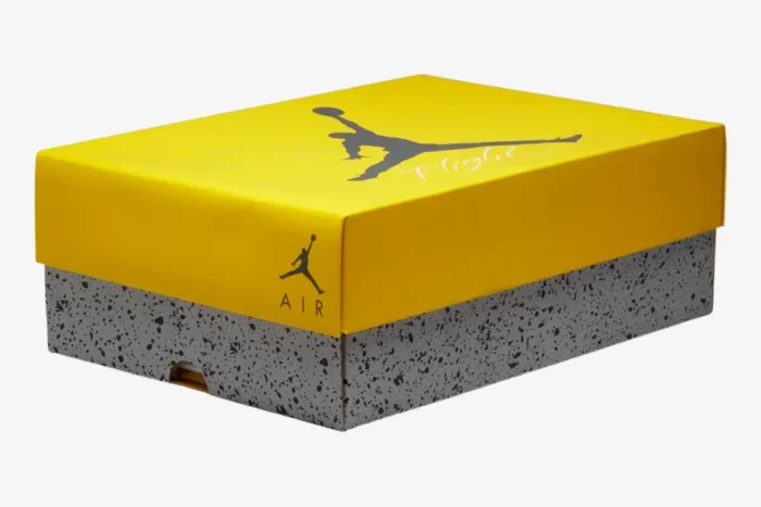 Yellow and grey speckled Air Jordan 4 Retro Lightning shoebox, three-quarter perspective view. - SKU CT8527-700