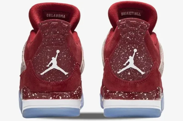 Rear view of red suede Air Jordan 4 Retro Oklahoma Sooners PE sneakers with white speckled heel tabs.