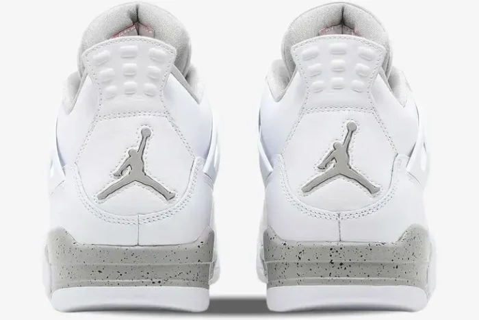 Rear view of Air Jordan 4 Retro White Oreo sneakers with silver Jumpman logo and speckled grey midsole. - SKU CT8527-100