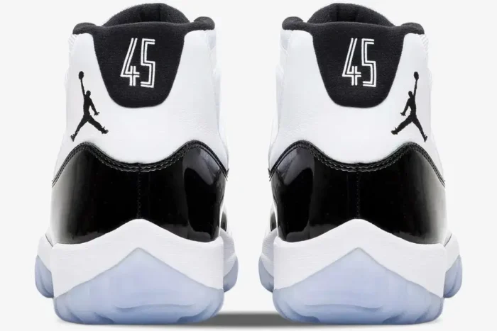 Rear view of Jordan Air Jordan 11 Retro Concord sneakers in white and black with number 45 on the heel. - SKU 378037-100
