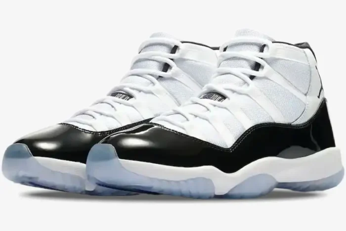 Jordan Air Jordan 11 Retro Concord sneakers in white and black, three-quarter side view. - SKU 378037-100