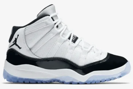 Side view of Jordan Air Jordan 11 Retro Concord in white and black with an icy blue sole. - SKU 378037-100
