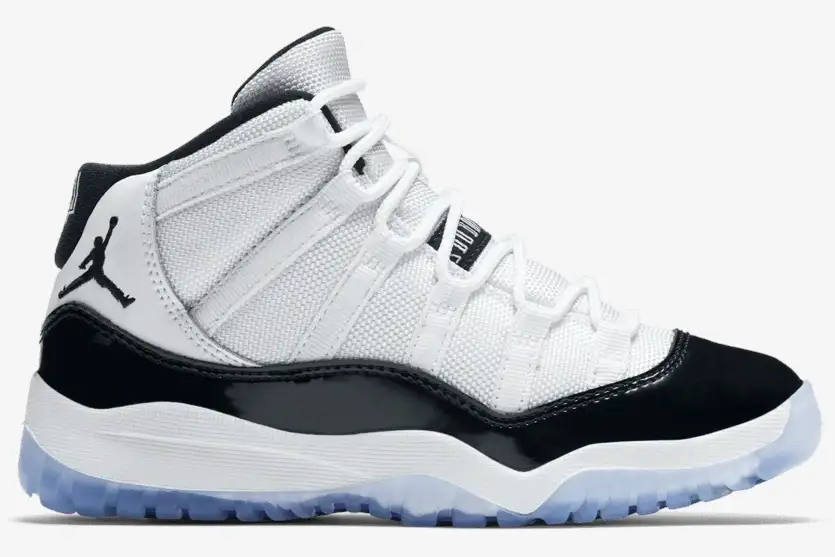 jordan-air-jordan-11-retro-concord-side-view-378037-100-537-307 Side view of Jordan Air Jordan 11 Retro Concord in white and black with an icy blue sole. - SKU 378037-100