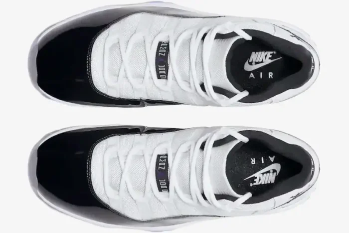 Top-down view of Jordan Air Jordan 11 Retro Concord sneakers in white and black with white laces. - SKU 378037-100