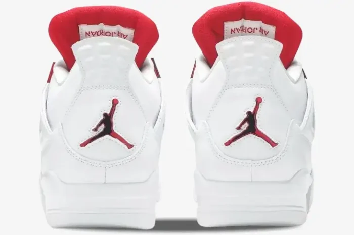 Rear view of Jordan Air Jordan 4 Retro Red Metallic sneakers featuring a red Jumpman logo on white leather. - SKU CT8527-112