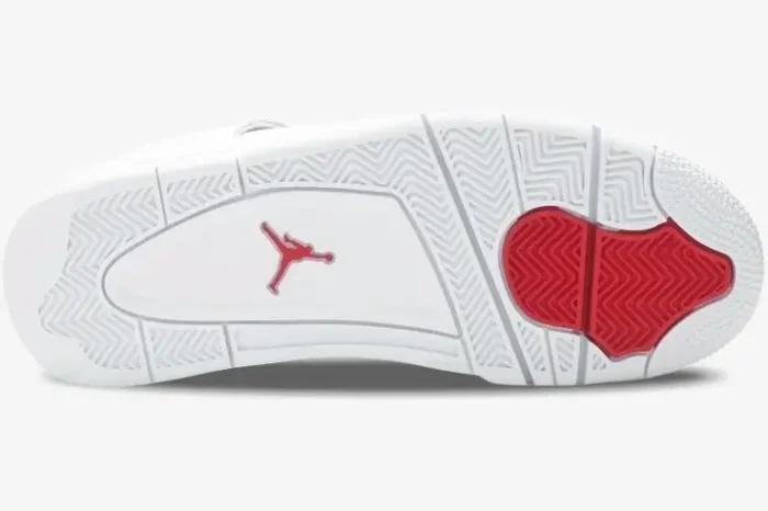 Bottom view of the Jordan Air Jordan 4 Retro Red Metallic shoe showing the white and red rubber outsole. - SKU CT8527-112
