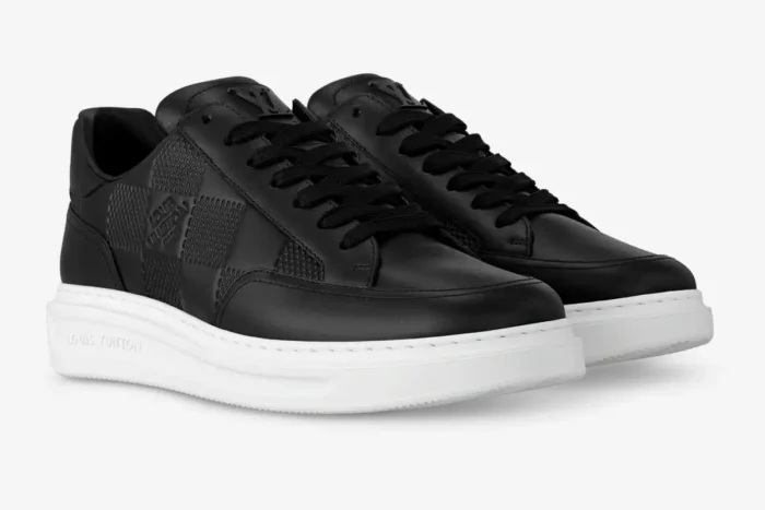 Louis Vuitton Beverly Hills sneakers in black Damier leather with white soles, three-quarter view. - SKU 1A5UFL