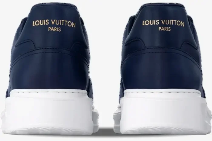 Rear view of Louis Vuitton Beverly Hills sneakers in marine blue leather with white soles and gold logo. - SKU 1ADFXW