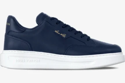 Side profile of a navy blue Louis Vuitton Beverly Hills sneaker with a white platform sole. - SKU 1ADFXW