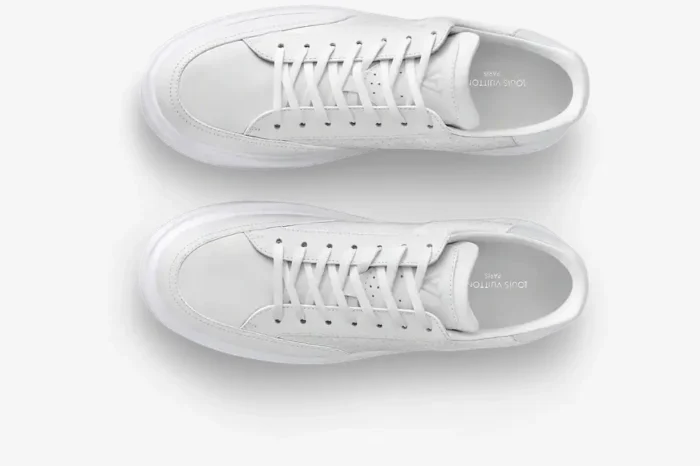 Top-down view of white Louis Vuitton Beverly Hills leather sneakers with small monogram pattern. - SKU 1AHQY3