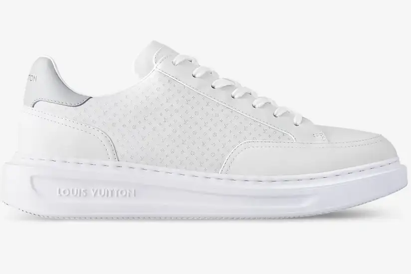 louis-vuitton-beverly-hills-white-monogram-side-1ahqy3-105-675 Side profile of a white Louis Vuitton Beverly Hills leather sneaker with a small monogram pattern. - SKU 1AHQY3