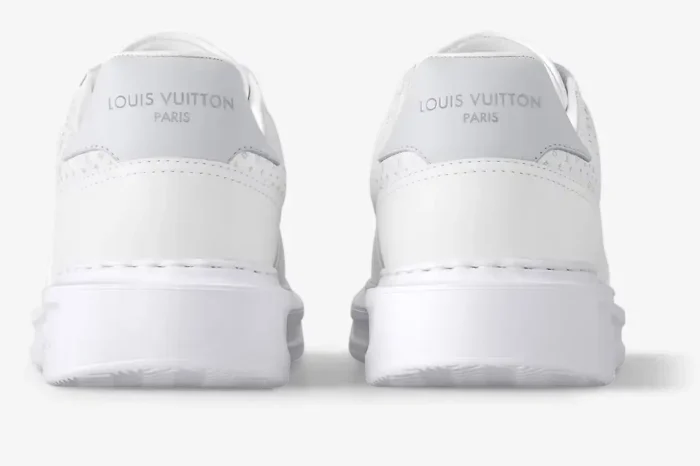 Rear view of white Louis Vuitton Beverly Hills leather sneakers with silver logo on the heel. - SKU 1AHQY3