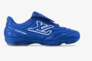 Side profile of blue Louis Vuitton Footprint Soccer Shoes x LV+VERS UNITED.