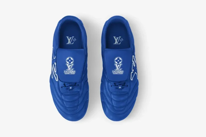 Overhead view of blue Louis Vuitton Footprint Soccer Shoes x LV+VERS UNITED with white branding.