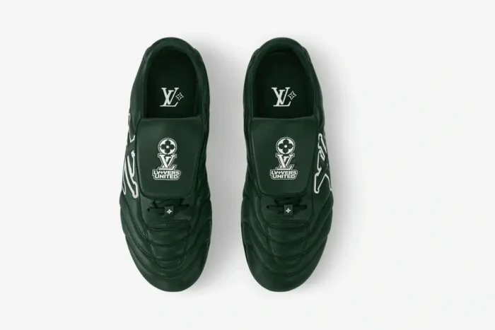 Top-down view of dark green Louis Vuitton Footprint Soccer Shoes, LV+VERS UNITED Edition with white logos.
