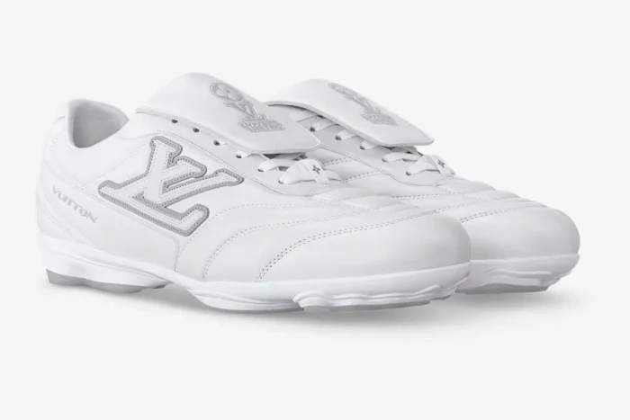 White Louis Vuitton Footprint Soccer Sneakers in a three-quarter side view profile. - SKU 1AFO4A