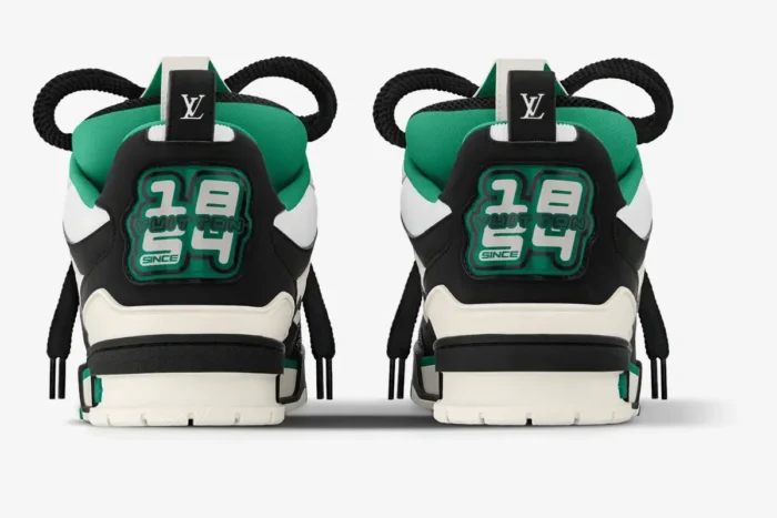 Rear view of Louis Vuitton LV Skate sneakers in black, white, and green with 1854 branding on the heel. - SKU 1ADE11