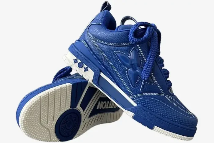 Blue and white Louis Vuitton LV Skate Sneakers shown from a side and bottom angle. - SKU 1ACQMN