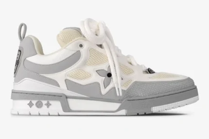 Louis Vuitton LV Skate sneaker in light grey and white, side profile view with chunky laces. - SKU 1ACQPA