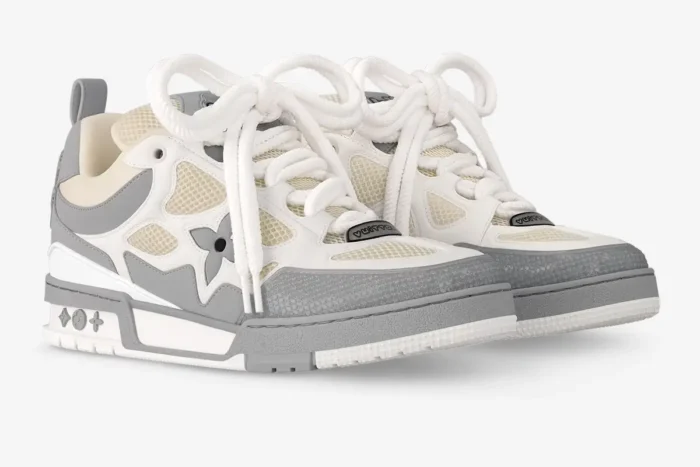 Three-quarter view of Louis Vuitton LV Skate sneakers in light grey and white with thick laces. - SKU 1ACQPA