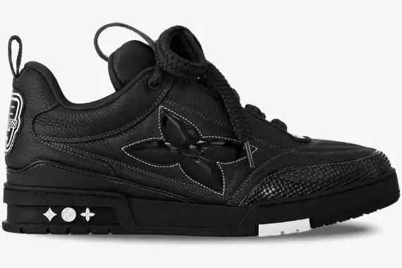 louis-vuitton-lv-skate-sneaker-black-side-view-1ab8i2-1abz5d-428-491 Side profile of a black Louis Vuitton LV Skate Sneaker with a large flower logo and thick laces. - SKU 1AB8I2-1ABZ5D