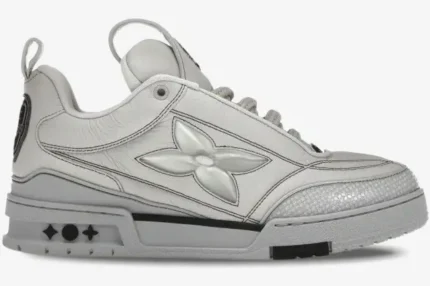 Side profile of a grey Louis Vuitton LV Skate Sneaker featuring a large monogram flower on the side. - SKU 1abz5x