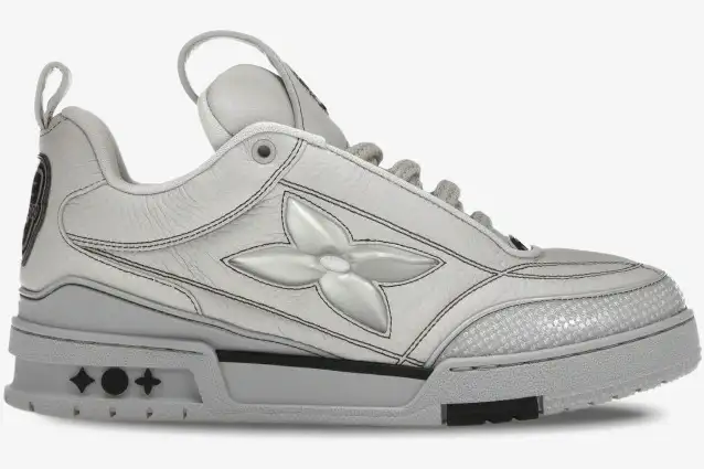 louis-vuitton-lv-skate-sneaker-grey-side-view-1abz5x-984-548 Side profile of a grey Louis Vuitton LV Skate Sneaker featuring a large monogram flower on the side. - SKU 1abz5x