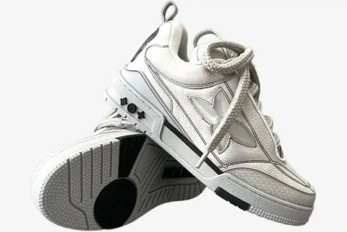 Louis Vuitton LV Skate Sneaker in grey with thick laces, shown in a stacked side and outsole view. - SKU 1abz5x
