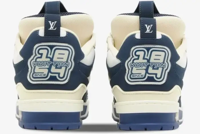 Rear view of Louis Vuitton LV Skate Sneakers in marine blue and white, showing the 1854 heel logo. - SKU 1AARRL