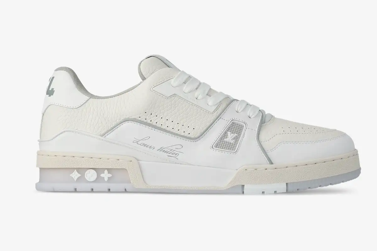 louis-vuitton-lv-trainer-54-white-leather-side-1aderb-719-095 Side profile of white Louis Vuitton LV Trainer #54 leather sneakers with signature script. - SKU 1ADERB
