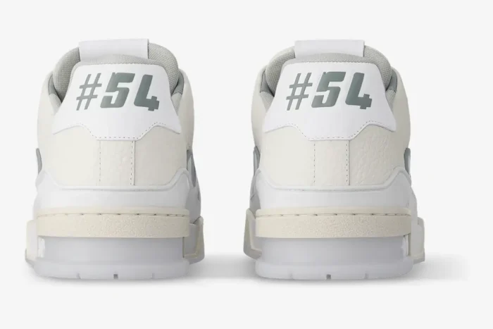 Rear view of Louis Vuitton LV Trainer #54 sneakers in white leather with grey accents. - SKU 1ADERB