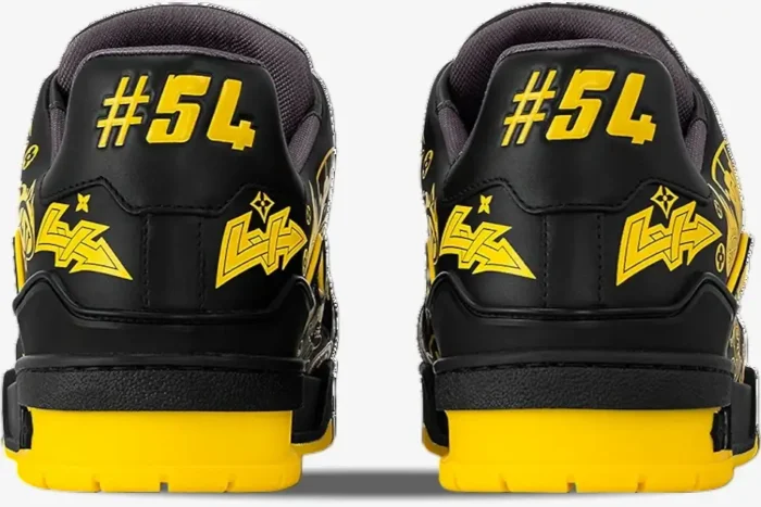 Rear view of Louis Vuitton LV Trainer sneakers in black and yellow with #54 graffiti detail. - SKU 1A9JTV