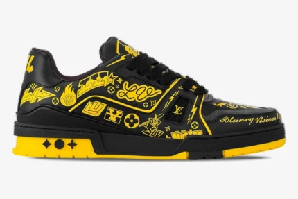 Side view of a Louis Vuitton LV Trainer sneaker in black and yellow with bold graffiti-style graphics. - SKU 1A9JTV