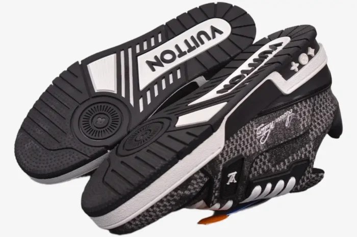 Louis Vuitton LV Trainer in black and white Damier 3D showing the outsole and side profile. - SKU 1A9ZAY